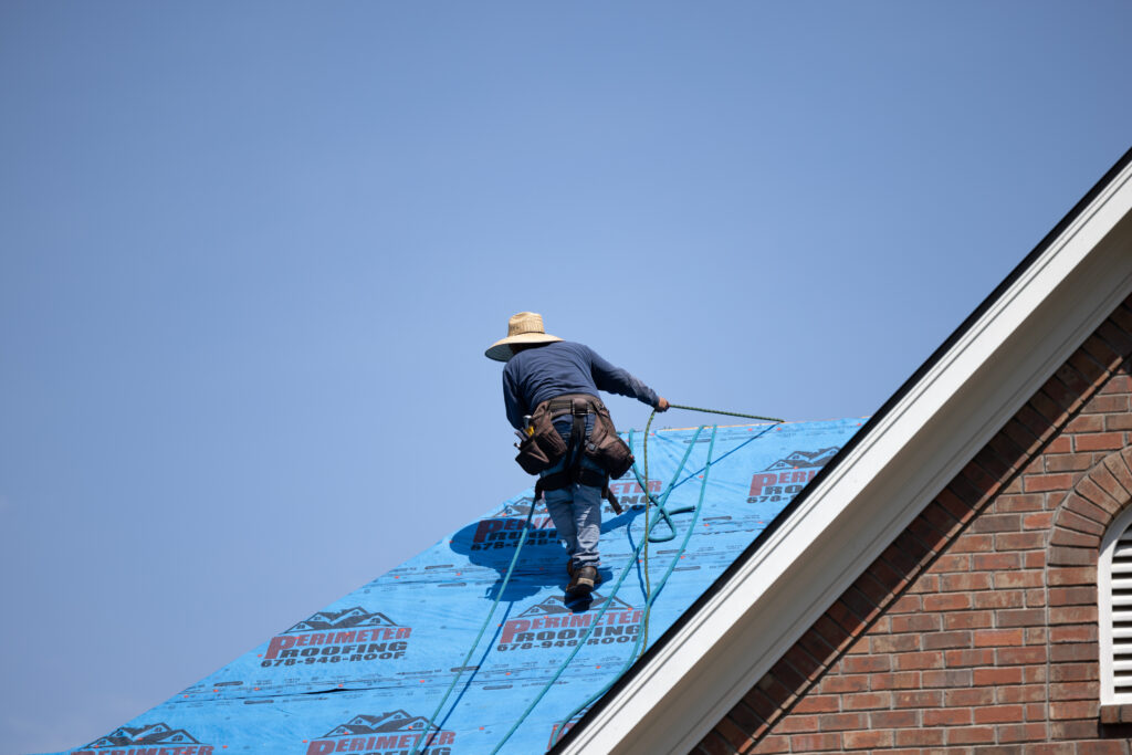 worker on a roof repair job