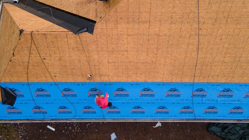 worker doing a roof install